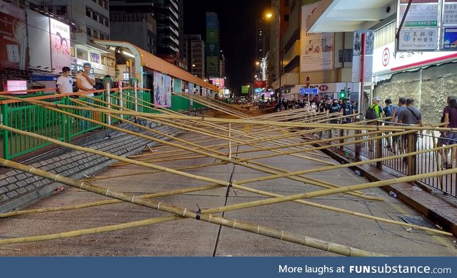 Protesters in HK set up bamboo road blocks