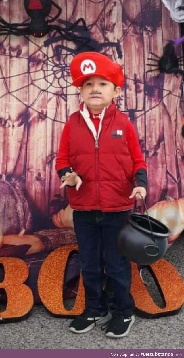 He really wanted his photo at the Halloween party, but was super scared of the spiders