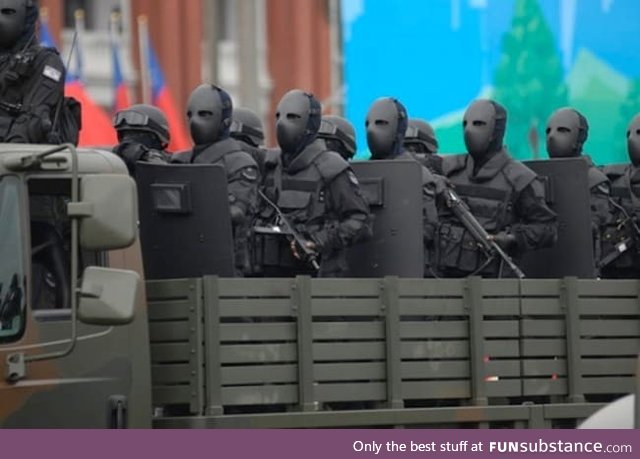 Taiwan Special Forces with bullet proof face masks look like they take sample c-19 pretty