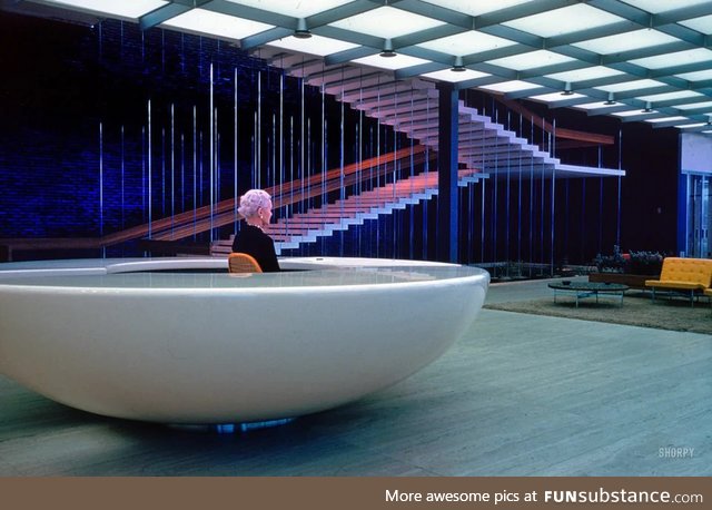 Receptionist waits at her desk. General Motors Technical Center, 1965