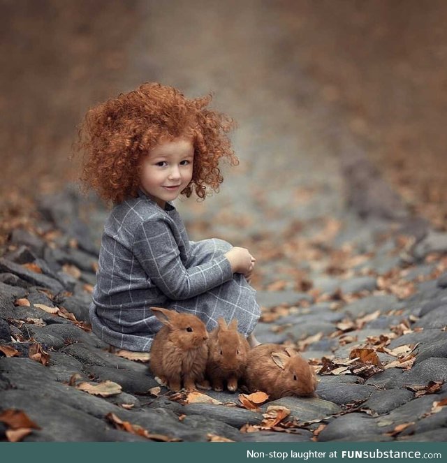 Little girl and her bunnies