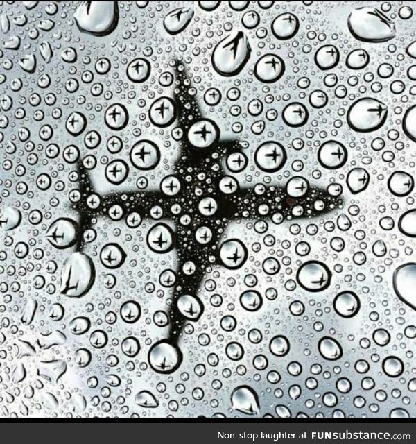 Picture of an airlane in raindrops