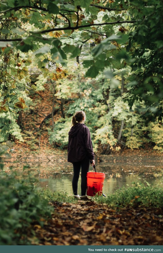 My girlfriend likes to pick up trash while we walk our dog. Here's a shot I took of her