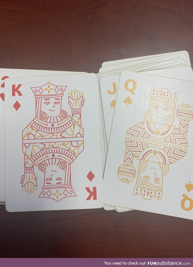 McDonald's themed deck has the queen holding the burger... For reasons