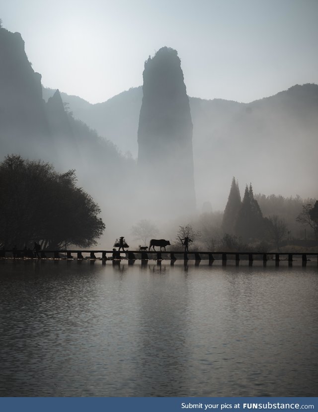 Chinese Farmers Crossing a Bridge