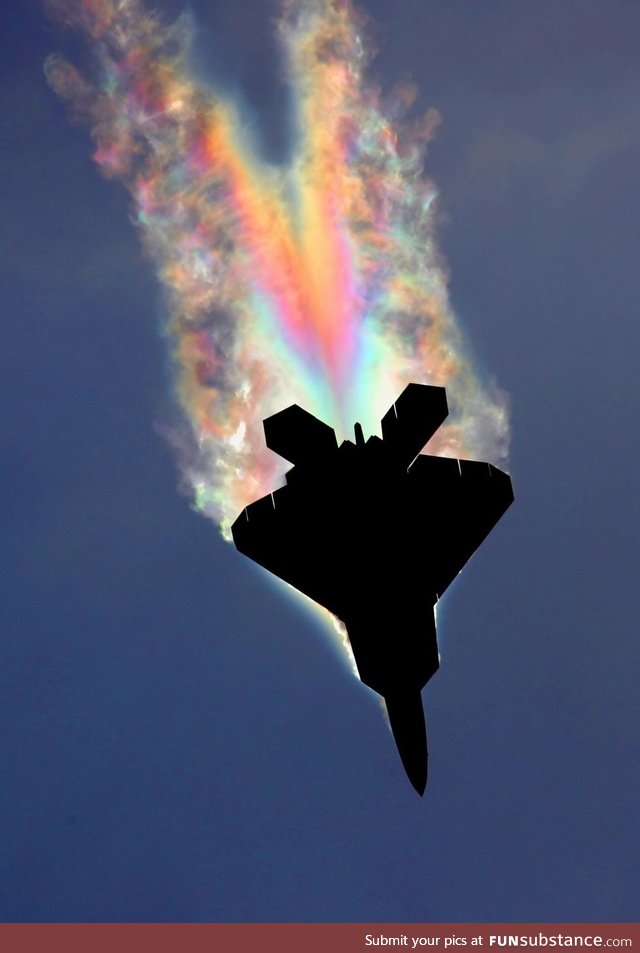 An F-22 Raptor pulling so many Gs the low pressure air over the fuselage gets cold enough