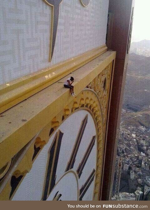 A Woman Sitting On The Abraj Al-Bait, circa Mecca