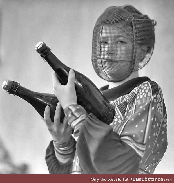 A champagne inspector wearing a special mask to protect against accidental discharge,