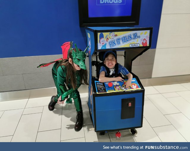 My son wanted to go as Fix-It Felix Jr, so we built an arcade machine to go over his