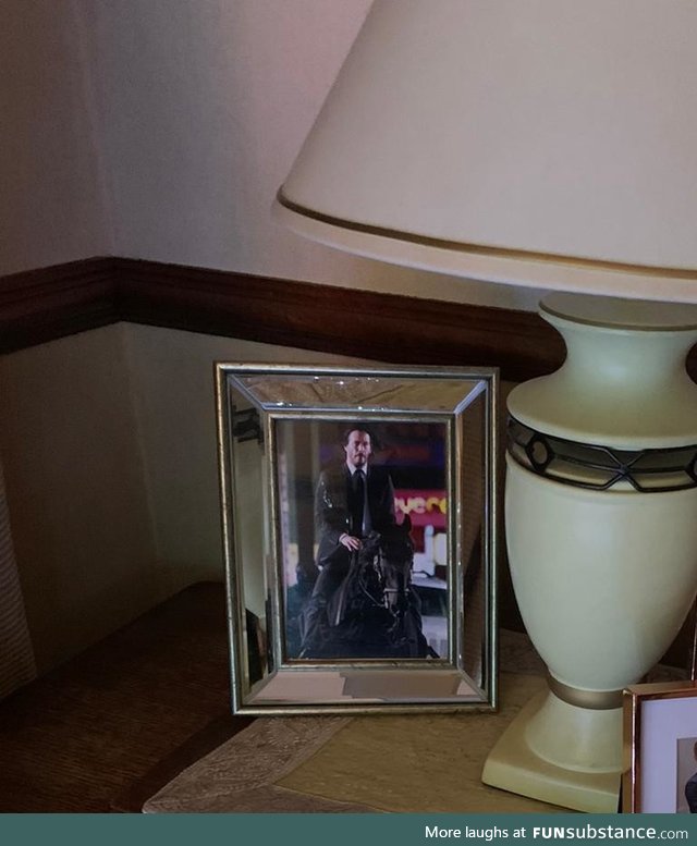 My sister switched a family wedding photo at my mum's house, to a picture of John Wick