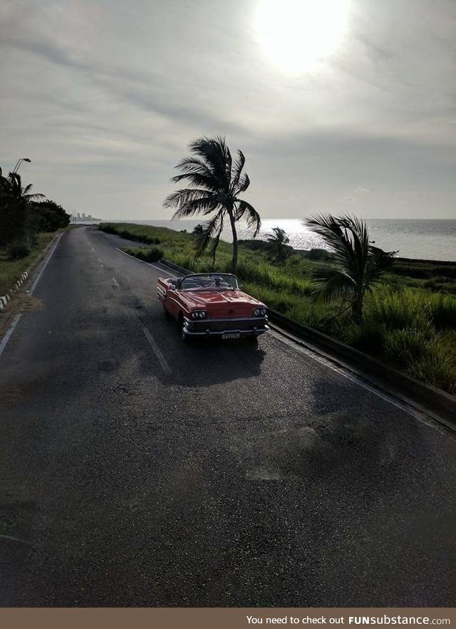 Cell Phone, tinted bus window, amazing shot. Havanna Cuba