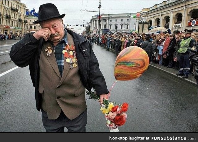 WW2 Vet walking alone on Victory Day. He is the last of his squad