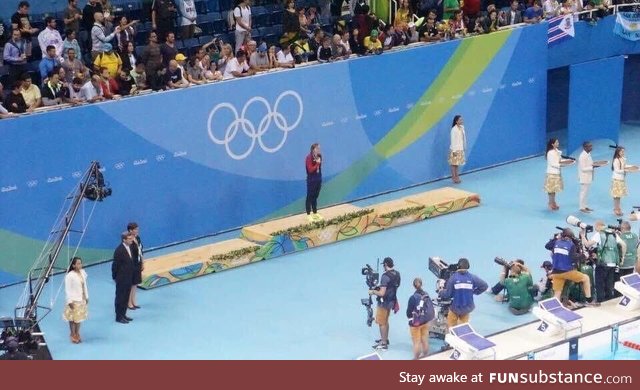 Katie Ledecky at her medal ceremony . . . Waiting for her opponents to finish the race