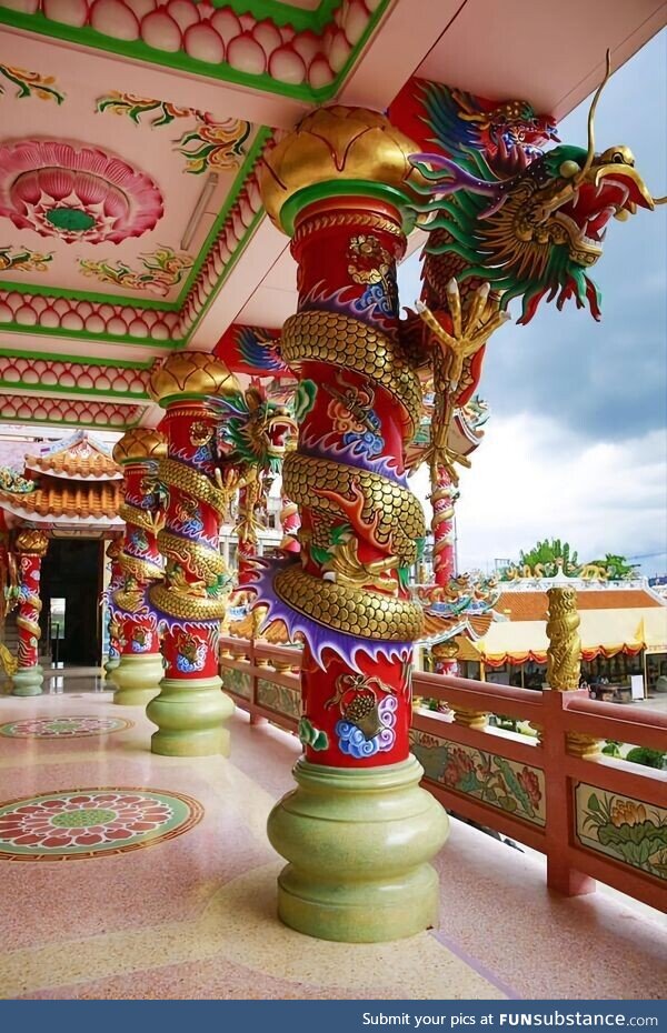 Golden dragons coiled round pillars at the Naja Shrine, Chinese temple at Angsila,