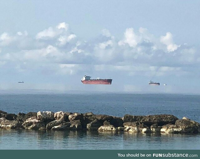 Fata Morgana mirage makes these Black Sea tankers seem to float in mid-air. The term