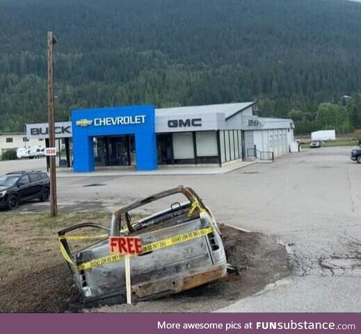 Someone put a FREE sign on a burnt out truck