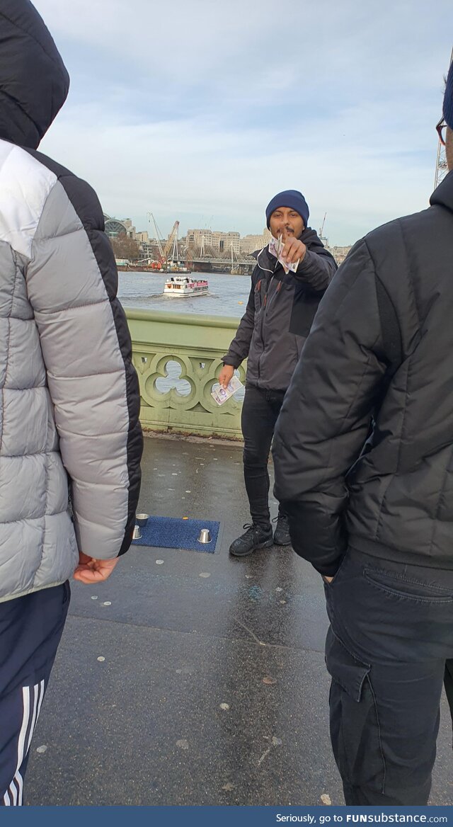 "No picture! Have some respect." Says the guy operating a 3 shell game in London