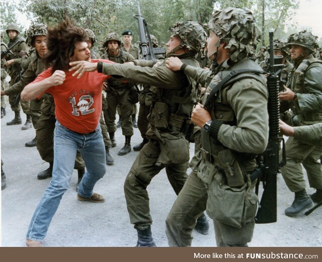 Mohawk warrior attacks Canadian soldiers during Oka crisis July-Sep 1990 which began when