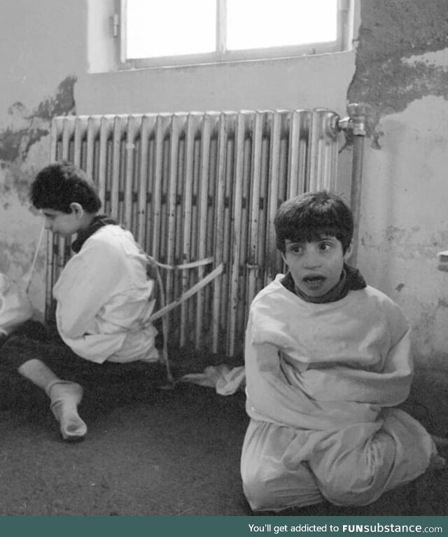 Two autistic kids tied to the radiator of a mental asylum in 1982. Yes, 1982