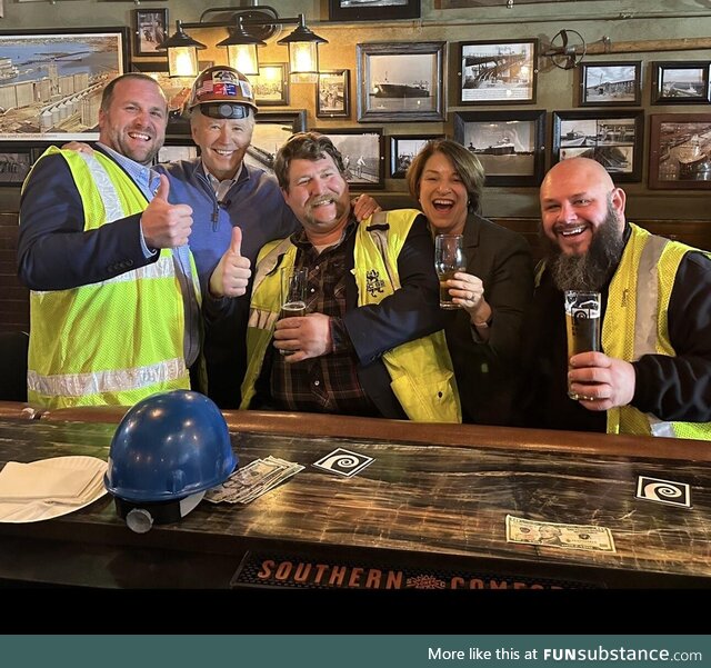 President Biden with union workers and his hard hat backwards