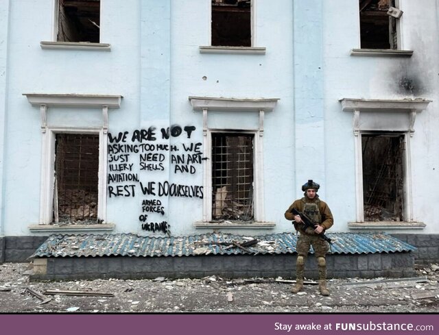 A Ukrainian Standing in Front of a Building