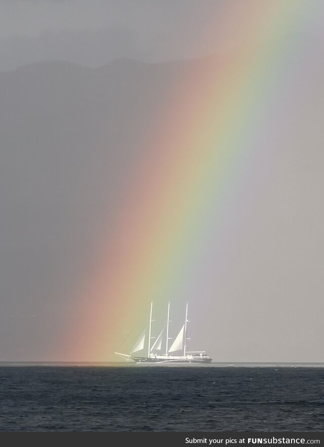 Sailing ship entering the rainbow