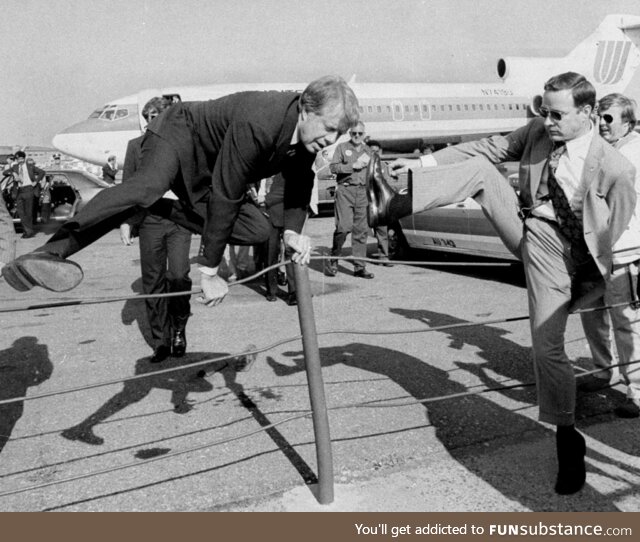 Jimmy Carter showing Secret Service how to properly jump over a fence