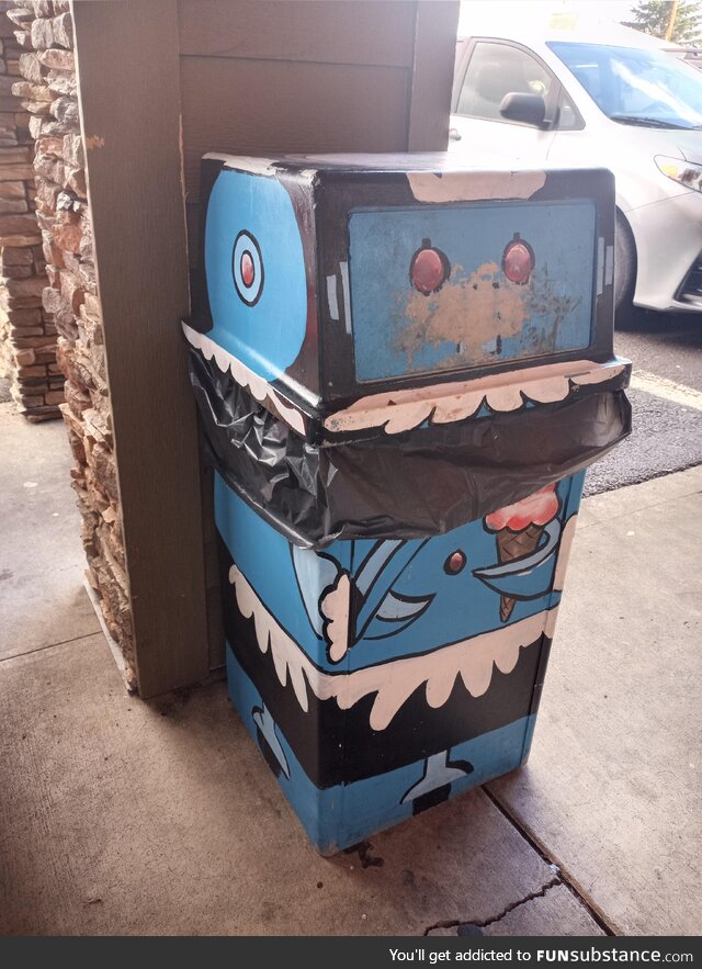 A trash can painted to look like Rosie from The Jetsons