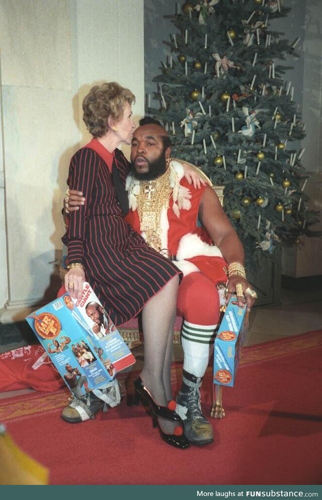 First Lady Nancy Reagan celebrating Christmas with Mr. T in 1983