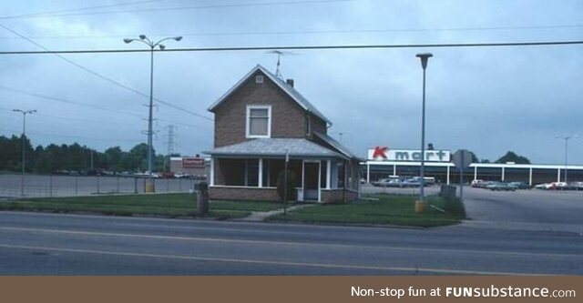 An old house in front of K-Mart in Lansing, MI back in 1970s