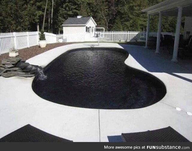 A swimming pool with a black liner looks like a death void into Hell