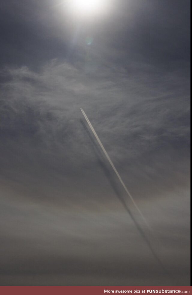 Our most recent total solar eclipse. Shadows cast by contrails on clouds. Montreal area