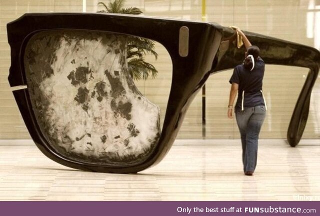 A statue of the broken glasses of Salvador Allende In the lobby of a Venezuelan ministry