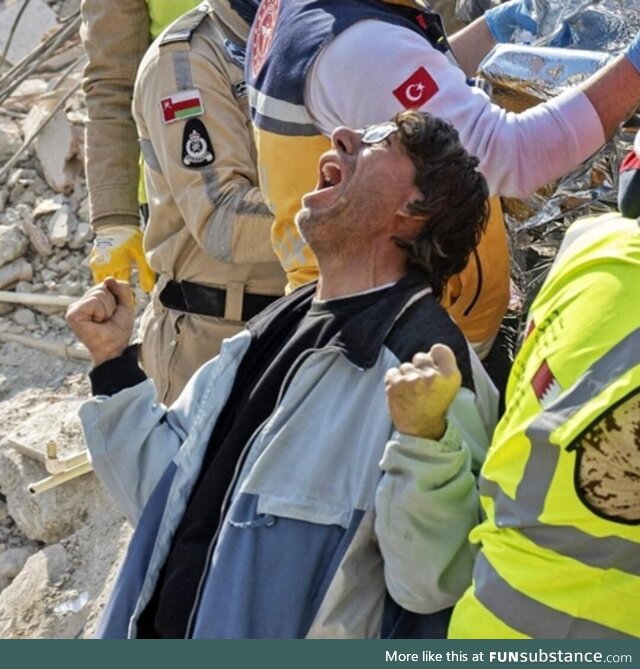 A Photo of a Man celebrating after his Mother was found alive, 176 hours after the