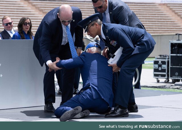 Biden being helped up after falling at the US Air Force Academy graduation ceremony