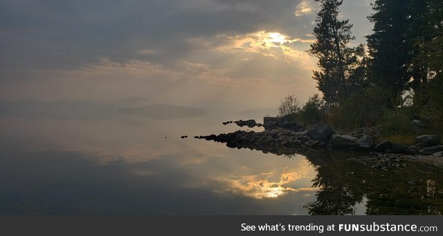 Smoky and glassy lakeshore