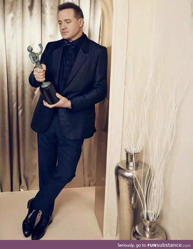 Brendan Fraser posing with his SAG award. Taken from his IG