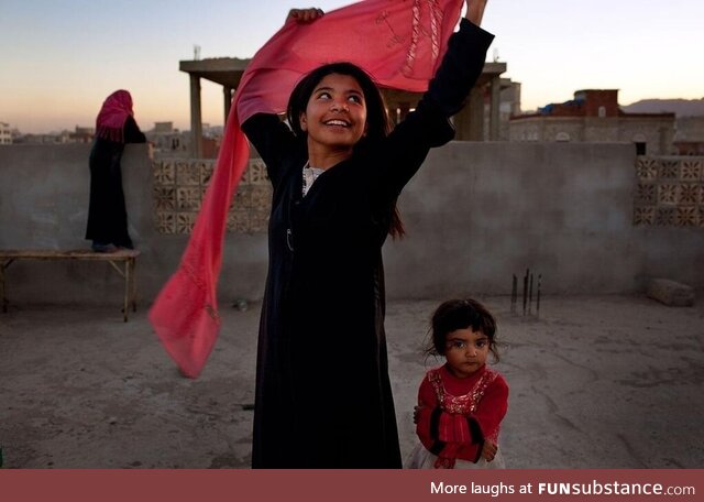 Yemeni child smiling after she was granted a divorce from her adult husband