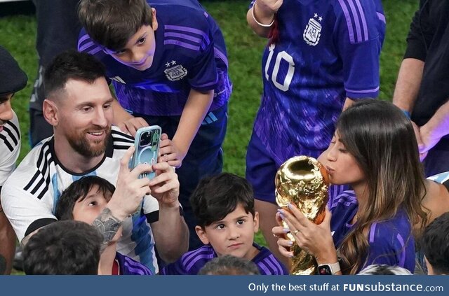 Messi taking picture of his wife