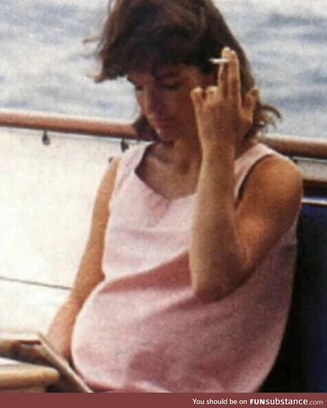 Pregnant Jackie Kennedy enjoying a cigarette, 1963