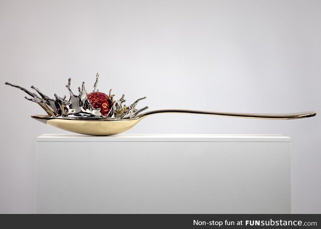 A 3-foot self balancing bronze spoon / stainless steel art sculpture I created