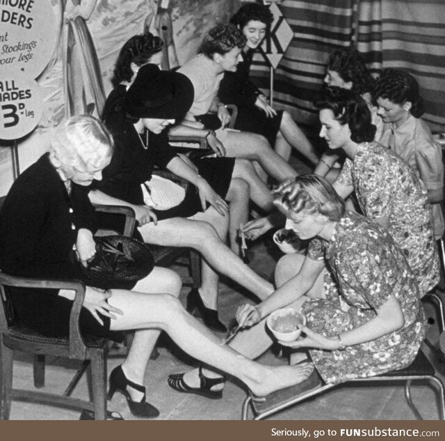 Women having stockings painted on instead of buying them during war time, 1941