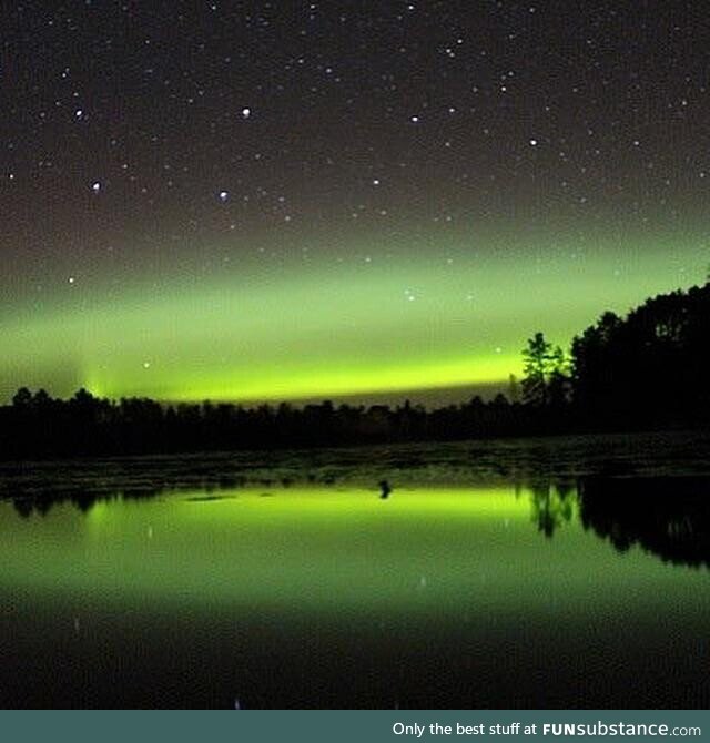 The beautiful northern lights with a star filled sky in norther Minnesota