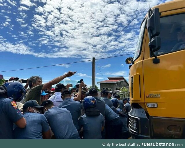 Residents in the Philippines set up a human barricade to stop illegal mining operations