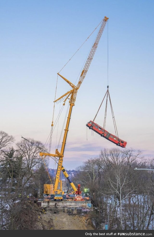 A bus being lifted off of a collapsed bridge in Pittsburgh. Credit to Dave DiCello