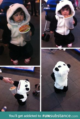 Little girl showing off her panda outfit