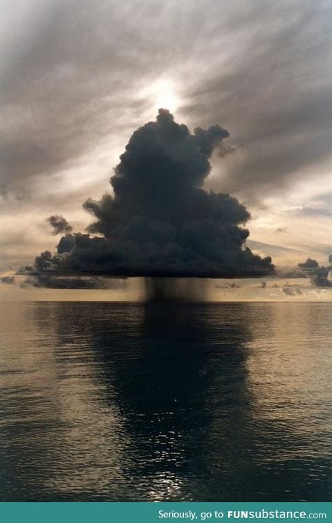 Rain cloud over the ocean