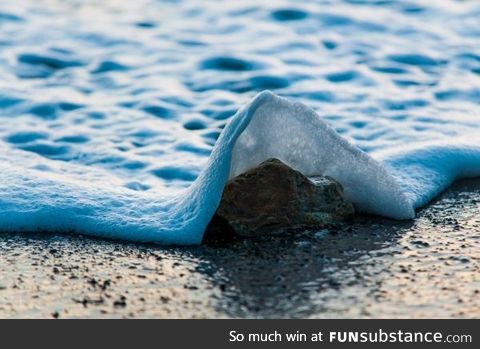 Seafoam splash captured at a thousandth of a second