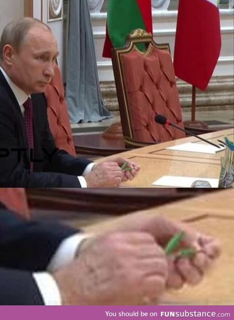 President Vladimir Putin snapping a pencil in half during the peace negotiations