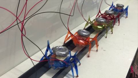 Team of µTug Microrobots Pulls a Car many times its weight